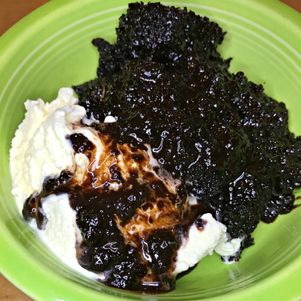 Dutch Oven Chocolate Lava Cake is sure to impress! The oohs and ahhhs when we took the lid off the Dutch Oven.  The wide-eyed expression as I scooped out the cake into 9 bowls and topped each with some vanilla ice cream.  And the happy, yummy sounds as they ate every last bite!