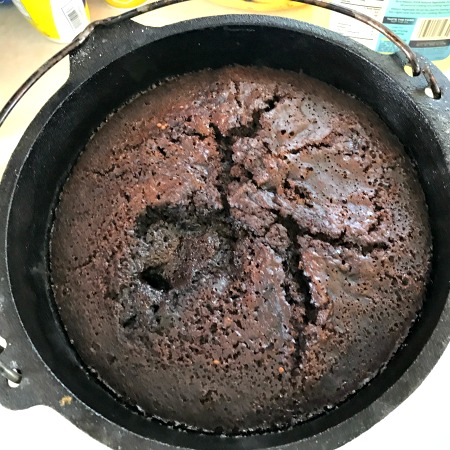 Dutch Oven Chocolate Lava Cake is sure to impress! The oohs and ahhhs when we took the lid off the Dutch Oven.  The wide-eyed expression as I scooped out the cake into 9 bowls and topped each with some vanilla ice cream.  And the happy, yummy sounds as they ate every last bite!