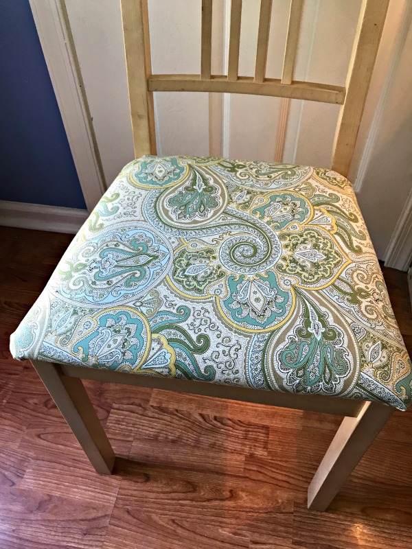 It only takes about 15 minutes to recover a chair cushion.  What a quick way to improve the look of your furniture without spending a lot of money!