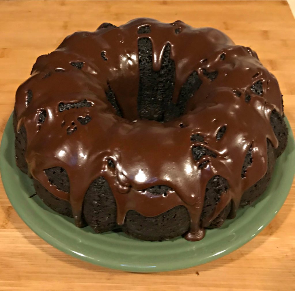 This Sinfully Rich Chocolate Cake can be made into a layer cake for birthdays, but with how rich it is, we prefer it without frosting and just a chocolate glaze drizzled across the top.  The addition of strong black coffee to both the cake batter and the glaze intensify the richness of the chocolate and leave just a light perfume of coffee behind.