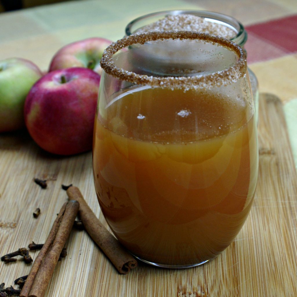 Spiced & spiked apple cider tastes like apple pie, with that little bit of extra heat in the back that you get from whiskey. Its the perfect fall cocktail!
